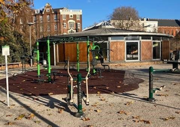 Outdoor gym equipment and brown buildings